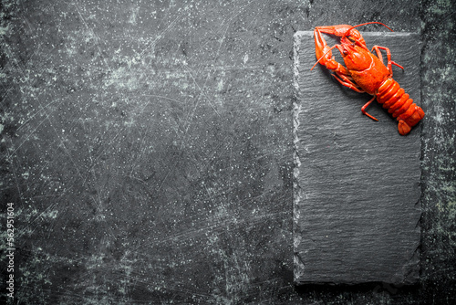 One boiled crayfish on a stone Board.