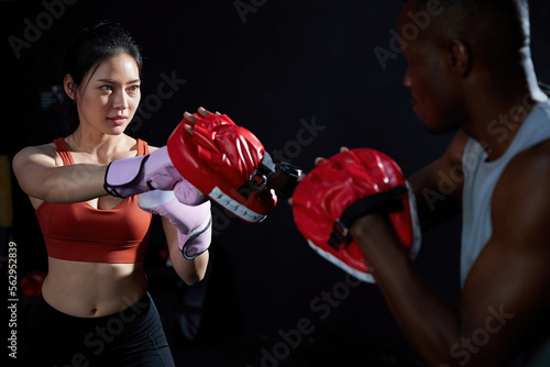sportswoman or fighter training boxing in the gym © offsuperphoto