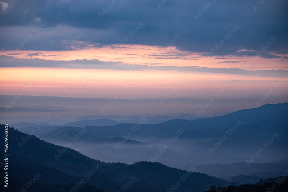 An image landscape forest layer mountain and fog or mist in the travel day vacation in the tourist in start the day winter atmosphere background.