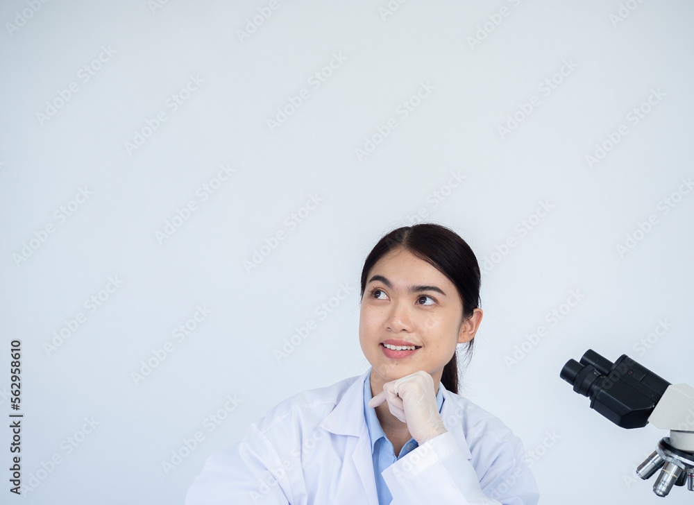 Portrait of happy Young Asian woman scientist against smiling and looing at the top. Portrait of happy Young Asian woman scientist against smiling and looing at the top.