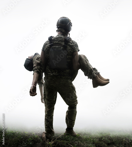 Print op canvas The commander carries a wounded soldier
