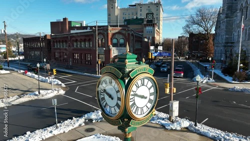 Slow aerial rising shot of City of Williamsport clock on snowy day in December. photo