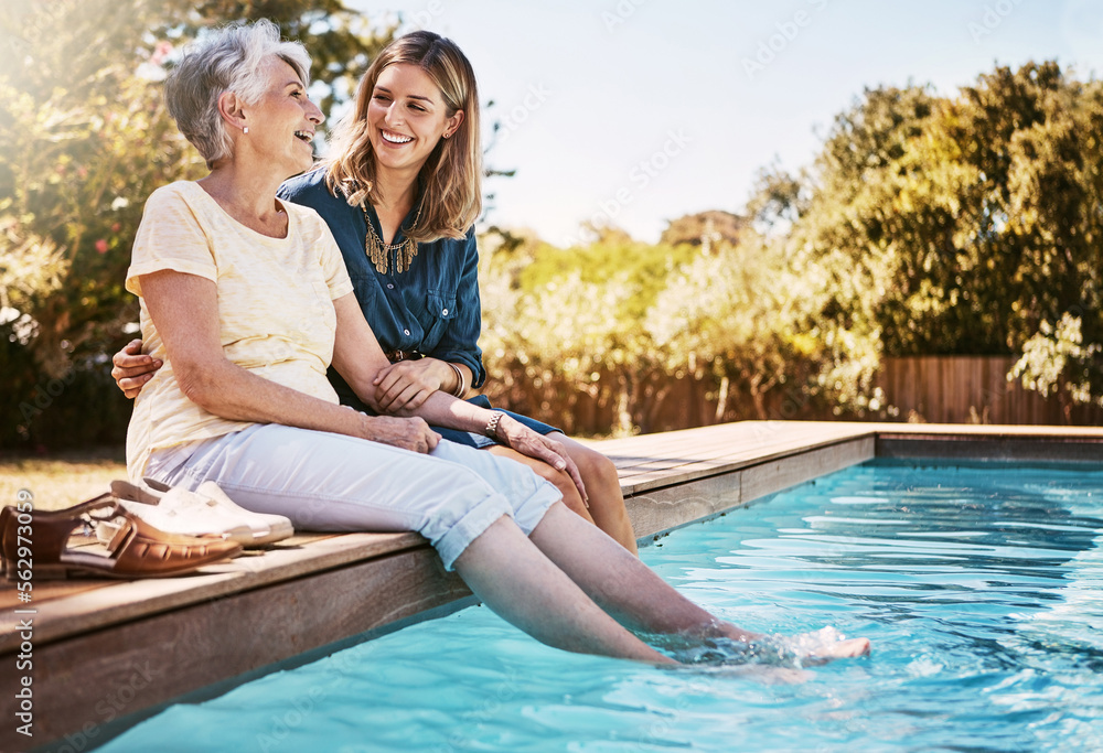 Fototapeta premium Family, women by pool and relax together with love and care, quality time in summer vacation. Elderly mother, daughter and vacation, outdoor swimming pool and wellness lifestyle with happy family