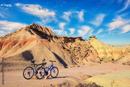 Couple of bicycles are parked photo