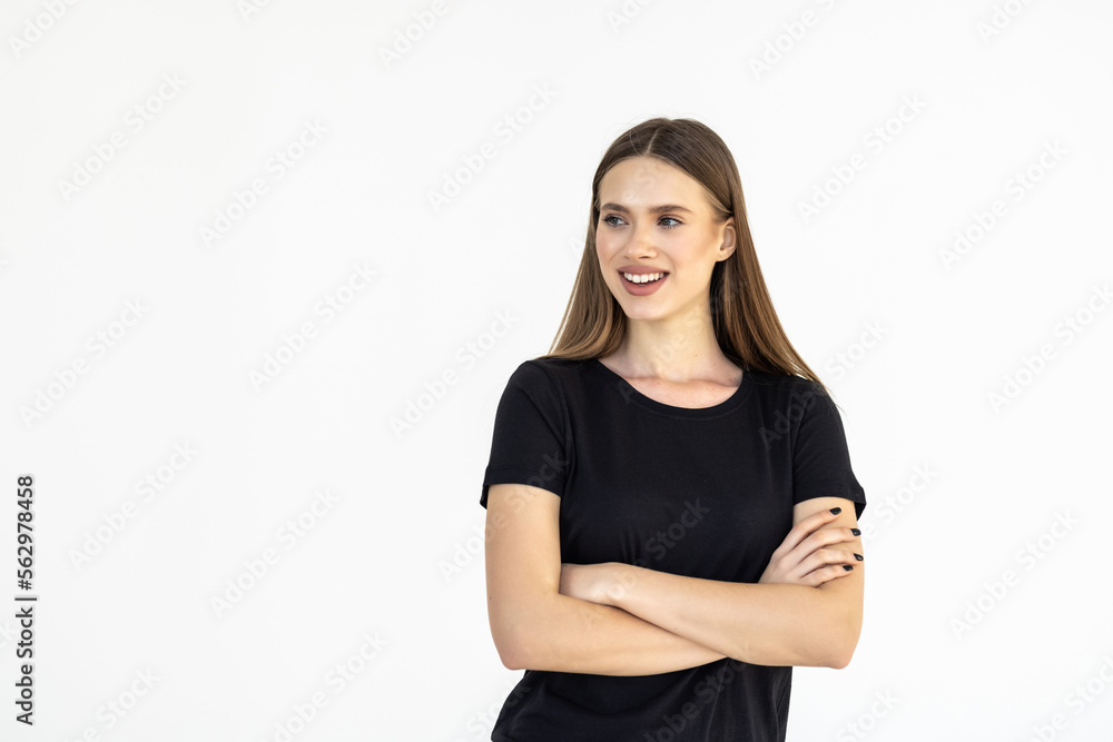 Smiling brunette woman posing with crossed arms and looking at the camera over white background Smiling brunette woman posing with crossed arms and looking at the camera over white background