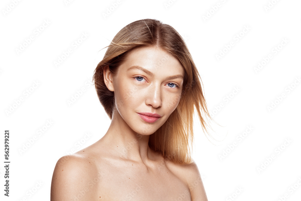 Natural beauty. Portrait of beautiful female model with healthy skin and natural blonde hair against white background. Natural beauty. Portrait of beautiful female model with healthy skin and natural blonde hair against white background.