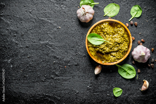 Pesto sauce in wooden bowl with Basil.