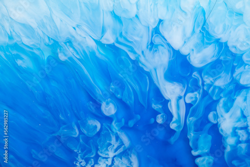 Part of original resin art, epoxy resin painting. Marble texture. Fluid art for modern banners, ethereal graphic design. Abstract ethereal blue and white swirl. © Mari Dein