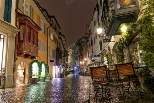 Famous alley named Augustinergasse on a snowy late autumn night with beautiful decorated stores and shops at City of Zürich. Photo taken December 10th, 2022, Zurich, Switzerland.