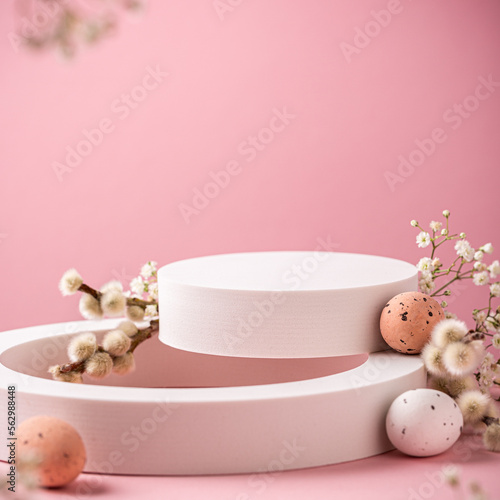 Composition with empty white podiums for products presentation or exhibitions on pink background with Easter quail eggs. Trend Concept with copy space.