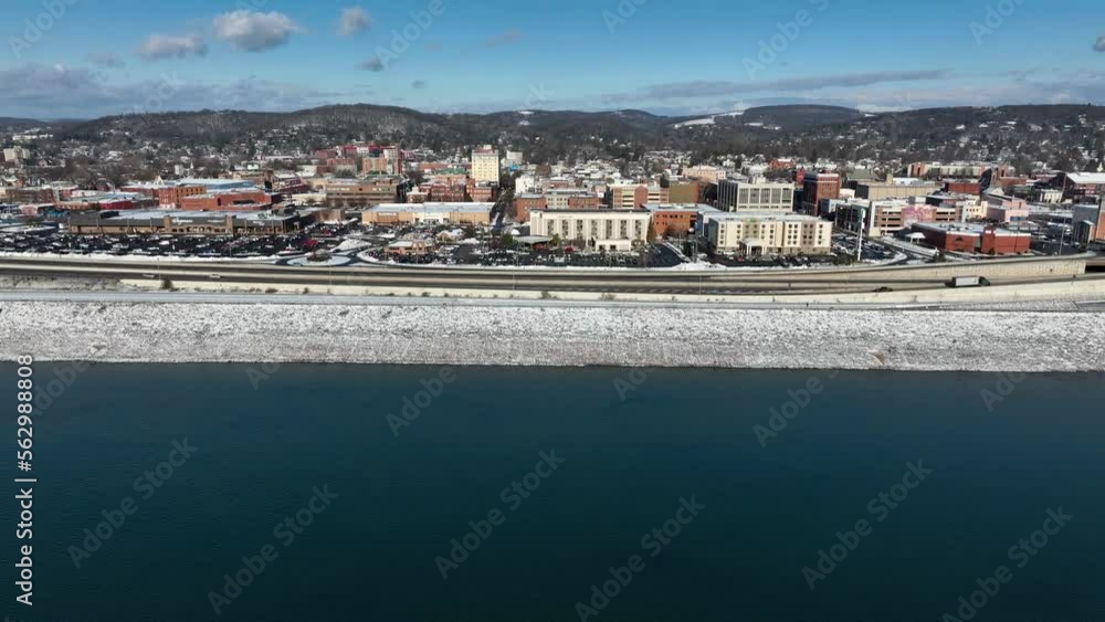 Aerial truck shot of snow covered Williamsport Pennsylvania during winter. Drone shot over Susquehanna River. Aerial truck shot of snow covered Williamsport Pennsylvania during winter. Drone shot over Susquehanna River.