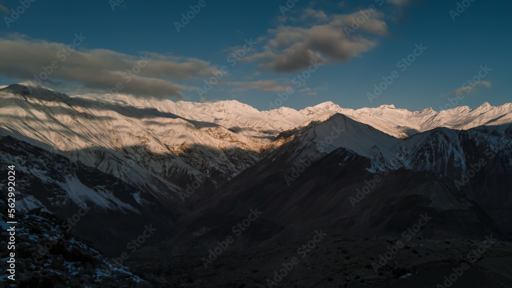 Spiti, Himachal Pradesh, India - April 1st, 2021 : Beautiful landscape with high mountains with illuminated peaks, Amazing scene with Himalayan mountains. Himalayas