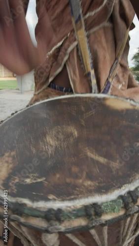 traditional african marimba player in traditional costume playing outdoors