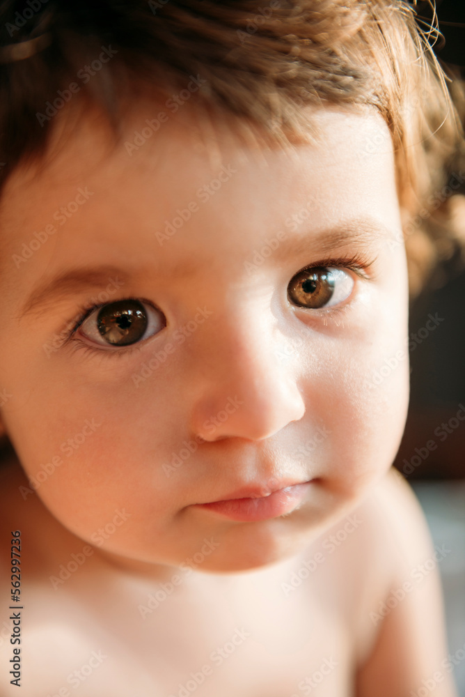 Close-up portrait of cute shirtless baby girl at home Close-up portrait of cute shirtless baby girl at home