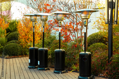 four Gas outdoor heater in a terrace bar surrounded by greenery in winter to warm the guests