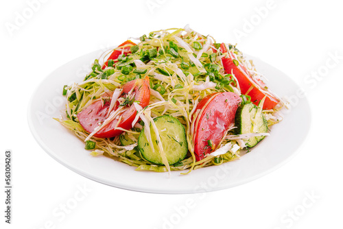 Salad from fresh cabbage, cucumbers and tomatoes