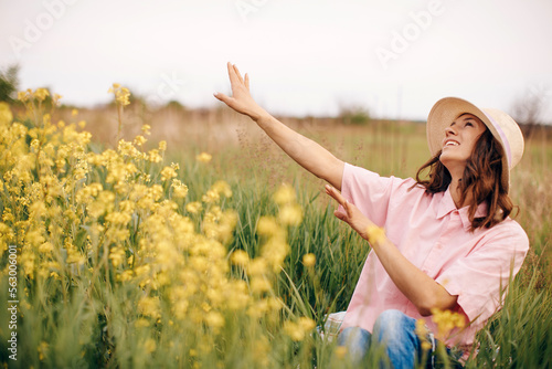 woman in the field of flowers. Happy day. Field background. 