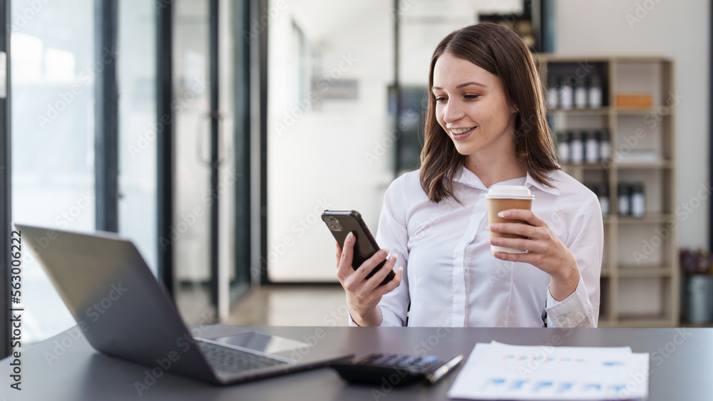 Smiling asian business woman with smartphone in office. Woman in casual at office Smiling asian business woman with smartphone in office. Woman in casual at office