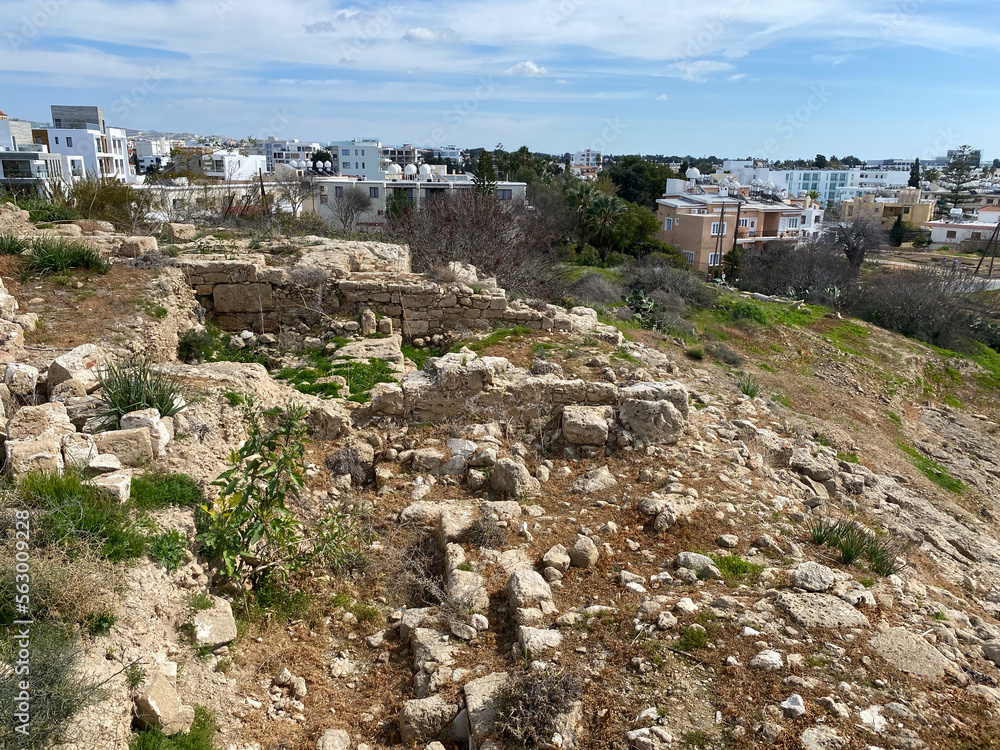 Ancient ruins against the backdrop of a modern city. Paphos, Cyprus, March.