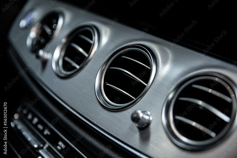 Ventilation and air conditioning vents in the interior of a modern car Ventilation and air conditioning vents in the interior of a modern car