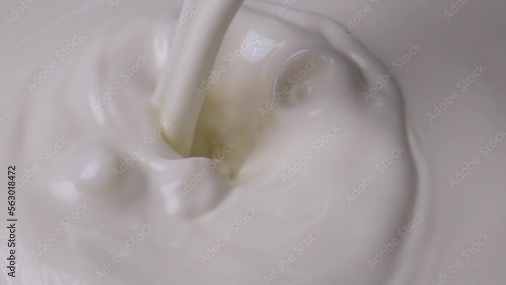 Splashes of milk and cream in super slow motion Splashes of milk and cream in super slow motion