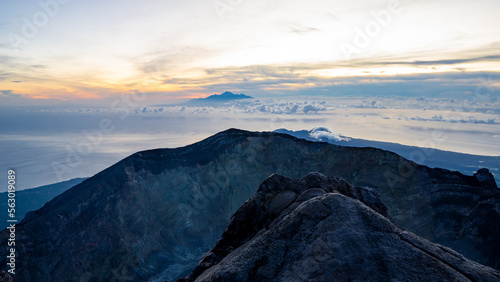 Sunrise at the top of the Ijen volcano. Panoramic view of East Java, Indonesia. The background of the natural landscape. © Amazing Travel Stock