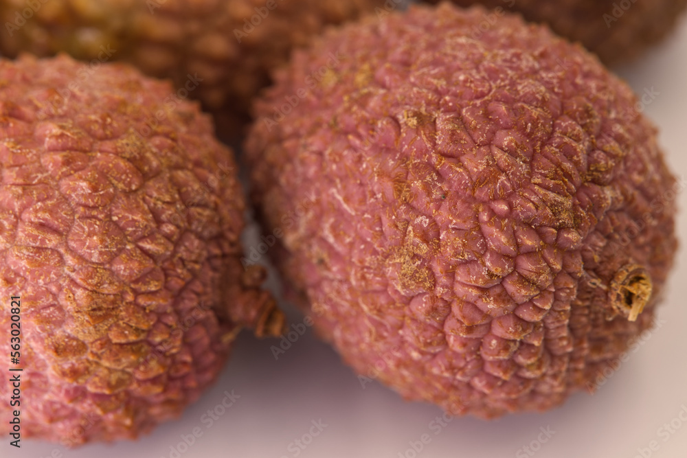 Lichi Fruits on white background. Close-up and selective focus. Macro. Lichi Fruits on white background. Close-up and selective focus. Macro.