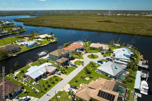 Destroyed by hurricane Ian suburban coastal houses in Florida home residential area. Consequences of natural disaster photo