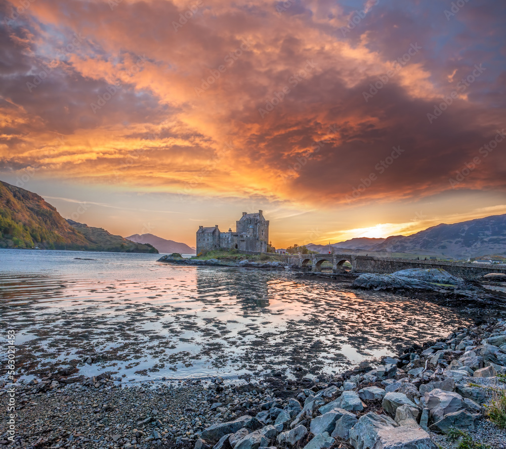 Colorful sunset against Eilean Donan Castle at Kyle of Lochalsh in the Western Highlands of Scotland