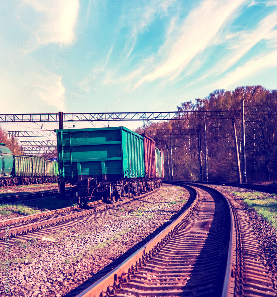 Industrial view with freight cars on a railway track.