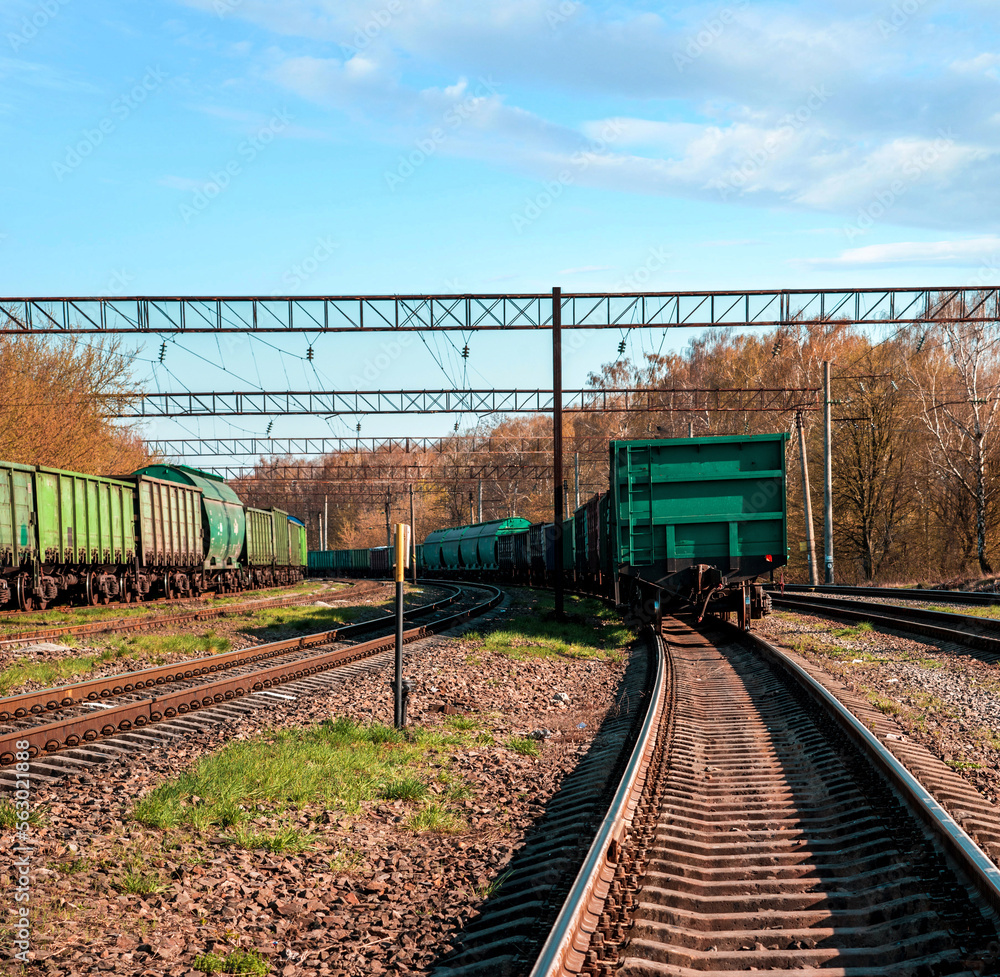 Industrial view with freight cars on a railway track.