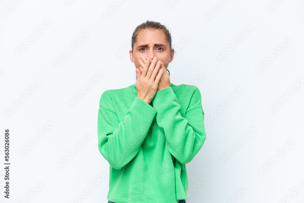 Young caucasian woman isolated on white background covering mouth with hands Young caucasian woman isolated on white background covering mouth with hands