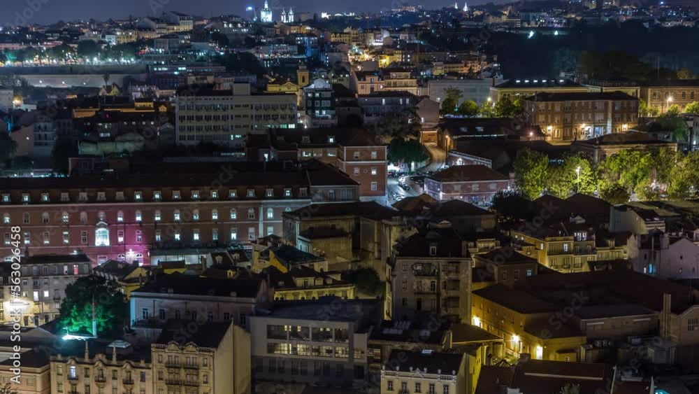 Lisbon aerial night overview of city centre with illuminated buildings at autumn timelapse, Portugal. Top view from Miradouro da Nossa Senhora do Monte viewpoint Lisbon aerial night overview of city centre with illuminated buildings at autumn timelapse, Portugal. Top view from Miradouro da Nossa Senhora do Monte viewpoint