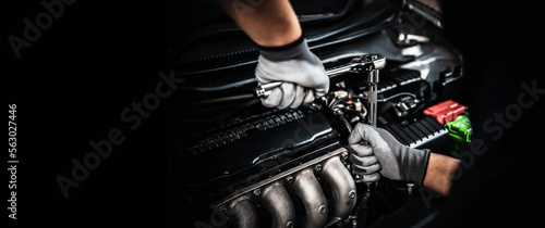 Car care maintenance and servicing, Close-up hand technician auto mechanic using the wrench to repairing change spare part car engine problem and car insurance service support.