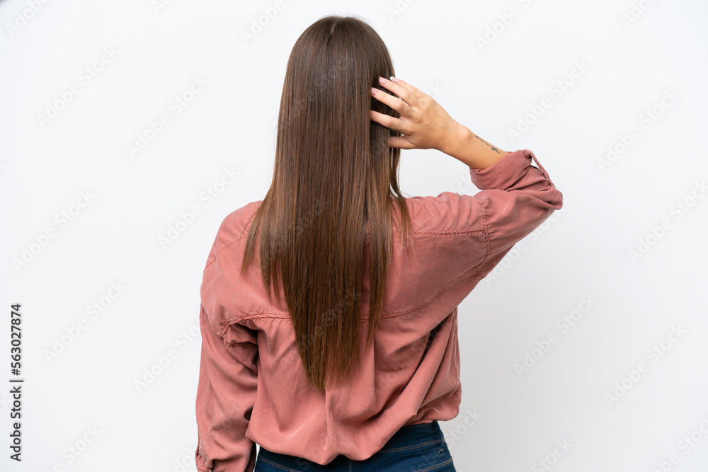 Young pretty caucasian woman isolated on white background in back position and thinking Young pretty caucasian woman isolated on white background in back position and thinking