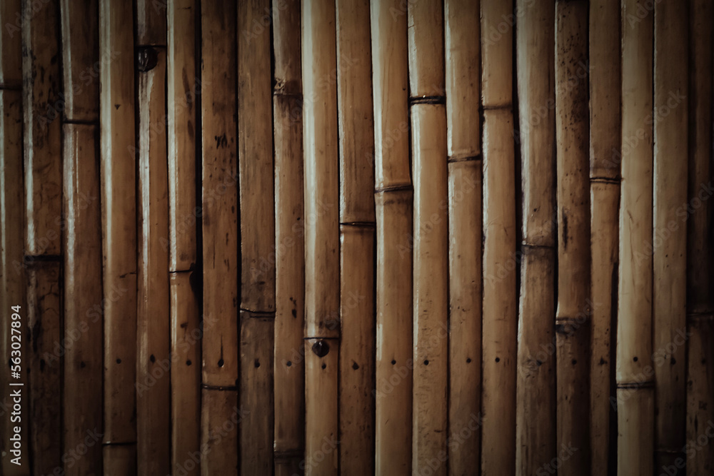 Naklejka premium brown bamboo texture background with light and shadow