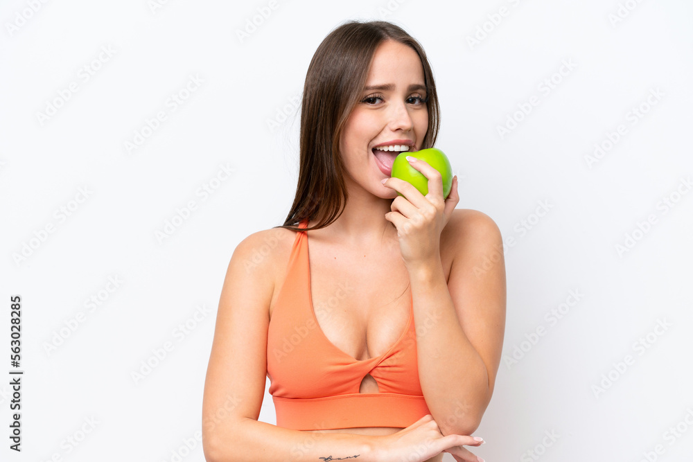 Young beautiful caucasian woman isolated on white background eating an apple Young beautiful caucasian woman isolated on white background eating an apple