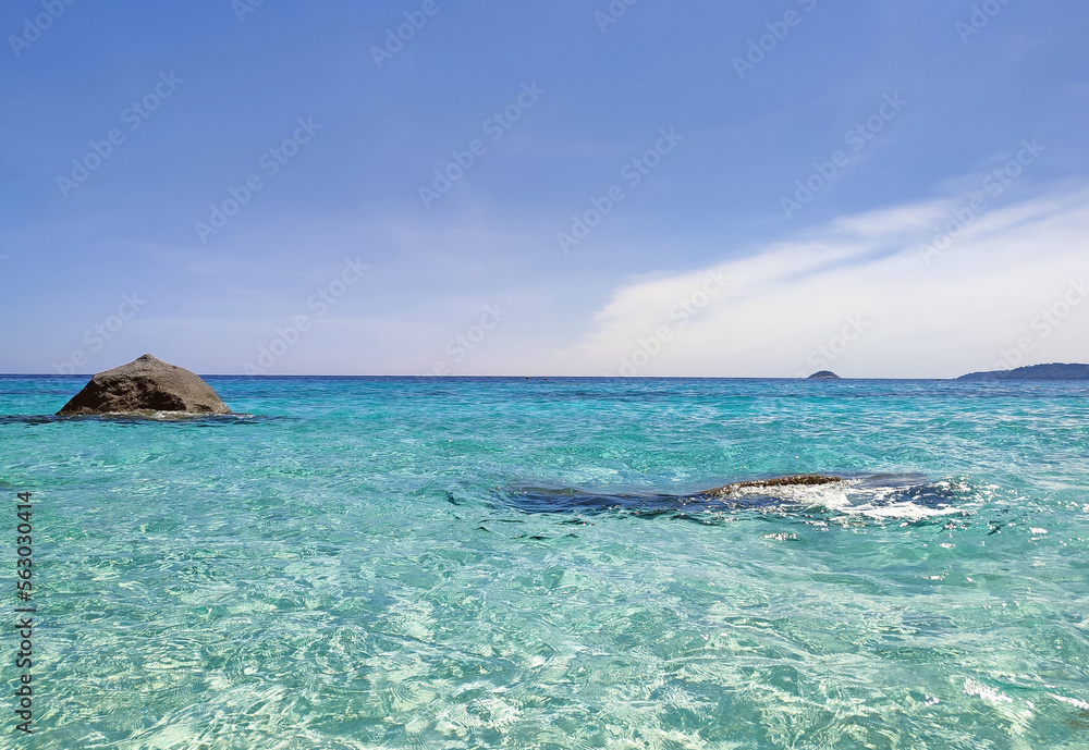 View of the turquoise sea against the blue sky with clouds for tourists. View of the turquoise sea against the blue sky with clouds for tourists.