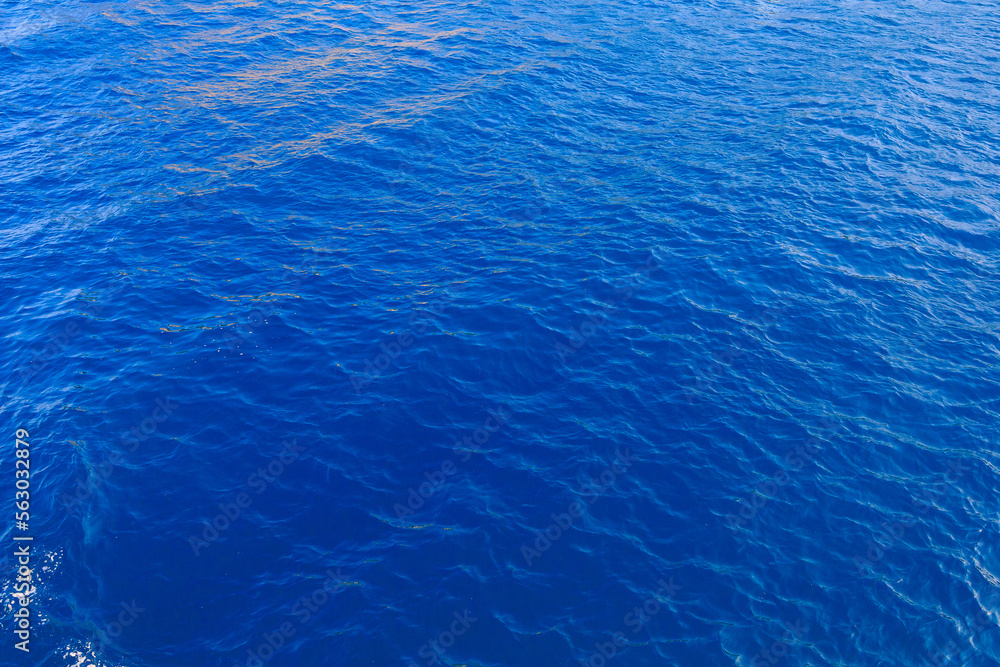 Obraz premium Very nice sea water background or backdrop with selective focus. Small waves of natural water surface texture.