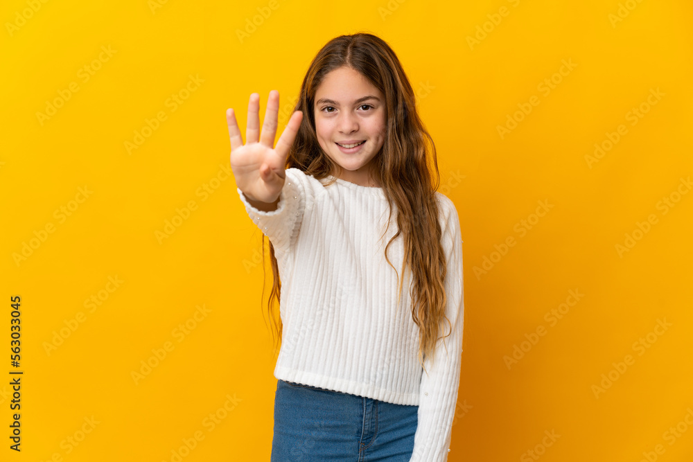 Child over isolated yellow background happy and counting four with fingers Child over isolated yellow background happy and counting four with fingers