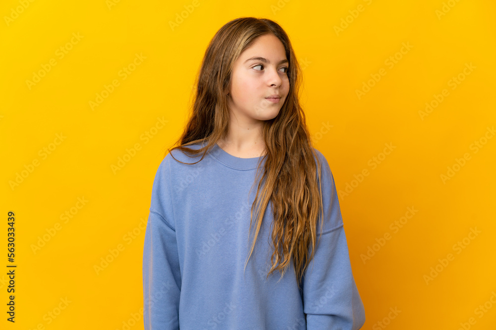 Child over isolated yellow background . Portrait Child over isolated yellow background . Portrait