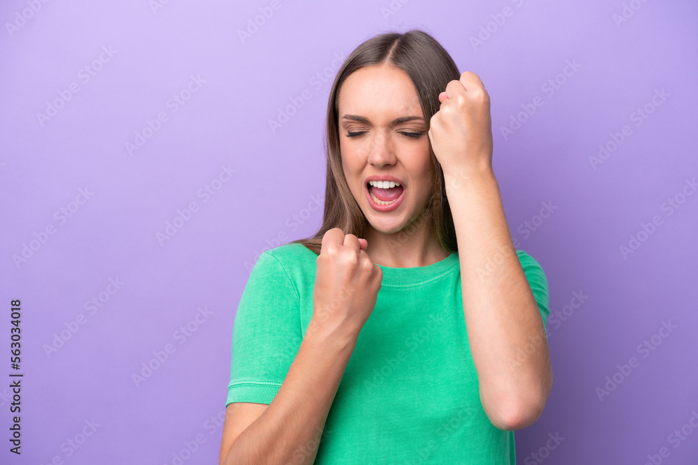 Young caucasian woman isolated on purple background celebrating a victory Young caucasian woman isolated on purple background celebrating a victory