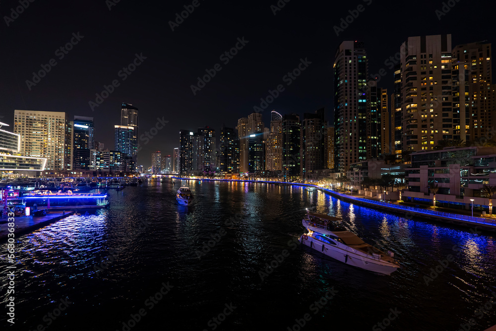 dubai marina night cruise. Luxury yachts in night lights on the water.