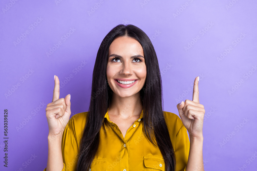 Photo of positive pretty lady wear stylish clothes demonstrate empty space advise buy new product isolated on purple color background Photo of positive pretty lady wear stylish clothes demonstrate empty space advise buy new product isolated on purple color background