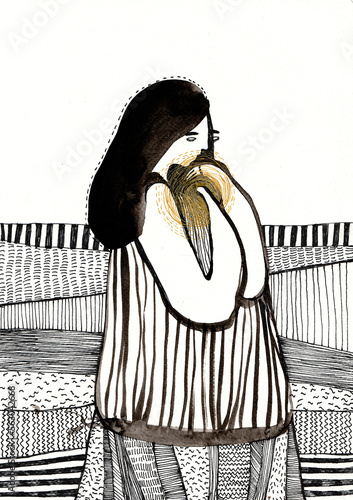 Woman holding a golden circle with fields on the background