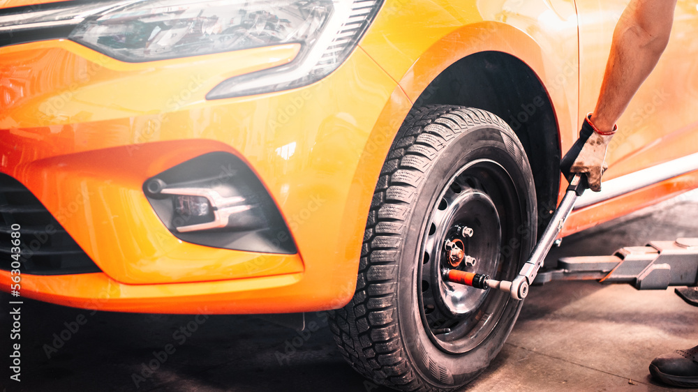 Car maintenance and auto service garage concept. Mechanic repairs detail.