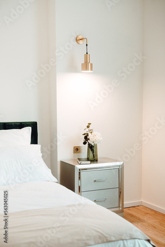 Details - Beautiful nightstand in elegant and comfortable modern bedroom. Interior design details