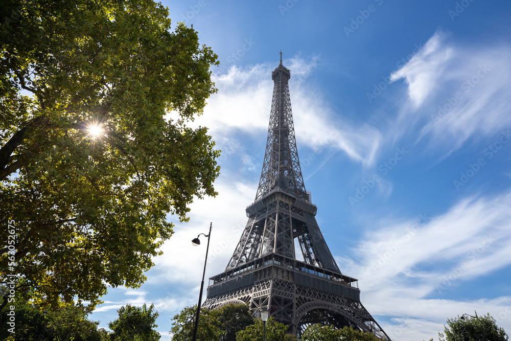 Eiffel tower in a sunny and cloudy day in Paris, France