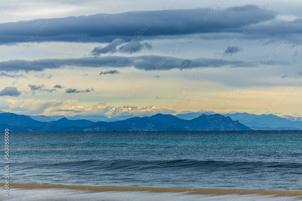 View of the the bay of St. Tropez, with snow covered Alpes Maritimes, France