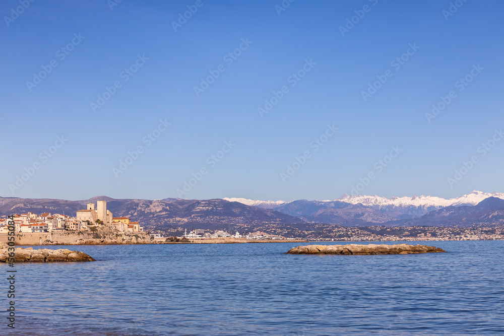 Fototapeta premium Town of Antibes with Snow covered Alpes Maritimes, Provence, France